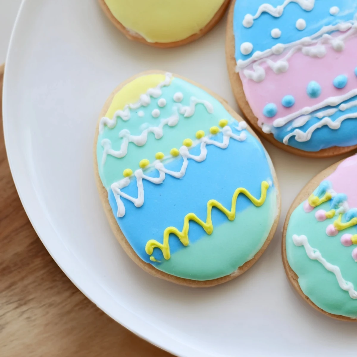 Colorful Easter Egg Sugar Cookies arranged on a platter, perfect for family dessert spreads.