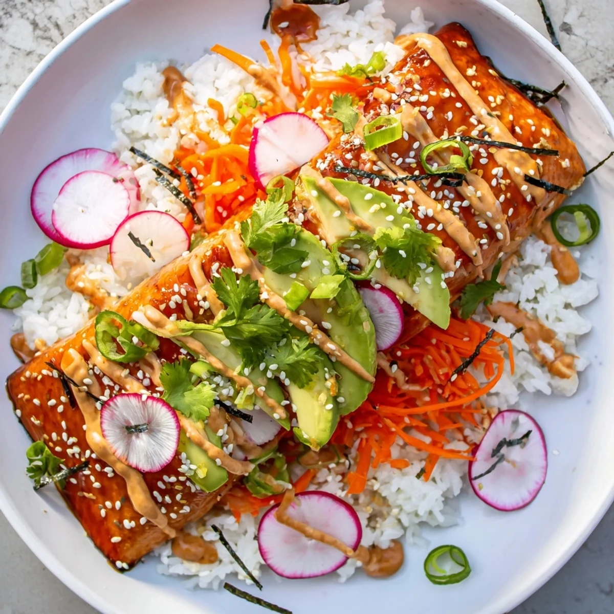 Flaky teriyaki-glazed salmon rests on fluffy jasmine rice with crunchy pickled veggies and creamy avocado slices.