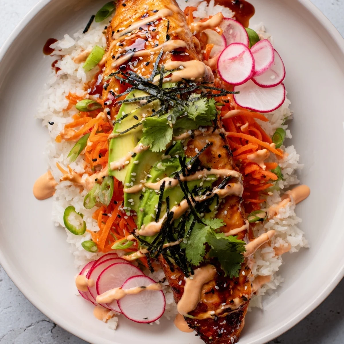 Tender salmon glazed with sweet teriyaki sauce sits atop rice in a vibrant taco-style bowl with pickled vegetables.