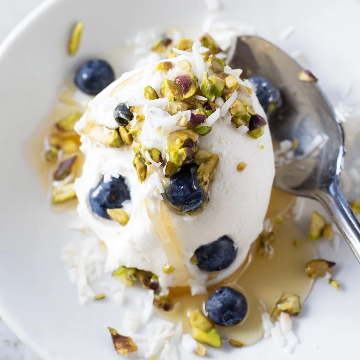 Healthy blueberry Greek yogurt bites featuring plump blueberries pressed into sweetened yogurt before freezing for a refreshing snack