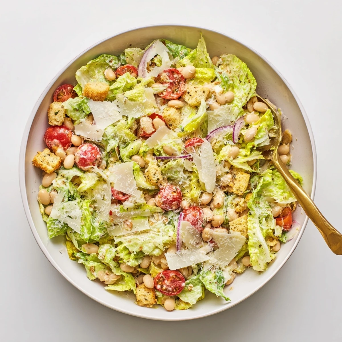 Creamy butter bean Caesar salad with crisp romaine, croutons and shaved Parmesan cheese
