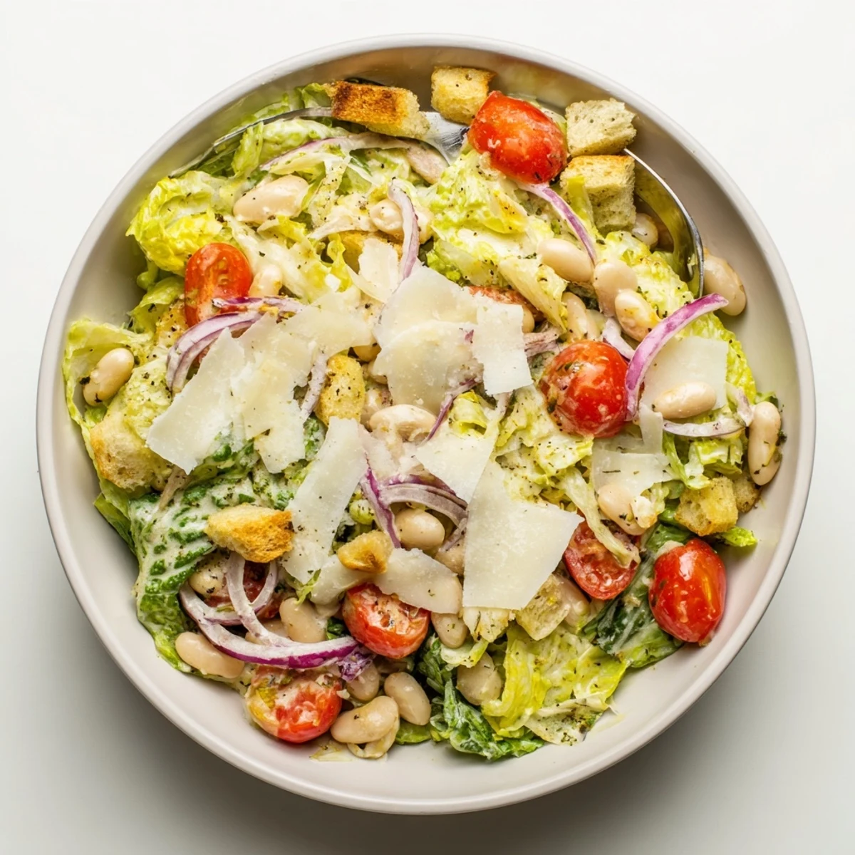 Butter bean Caesar salad bowl featuring creamy beans, crisp lettuce and golden crunchy croutons