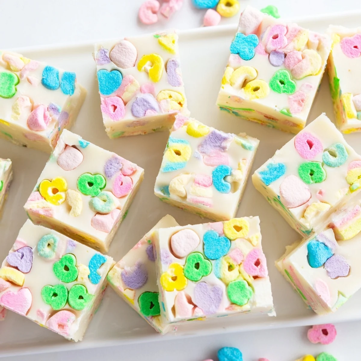 Smooth white chocolate Easy Lucky Charms Fudge sprinkled with crunchy colorful cereal marshmallows