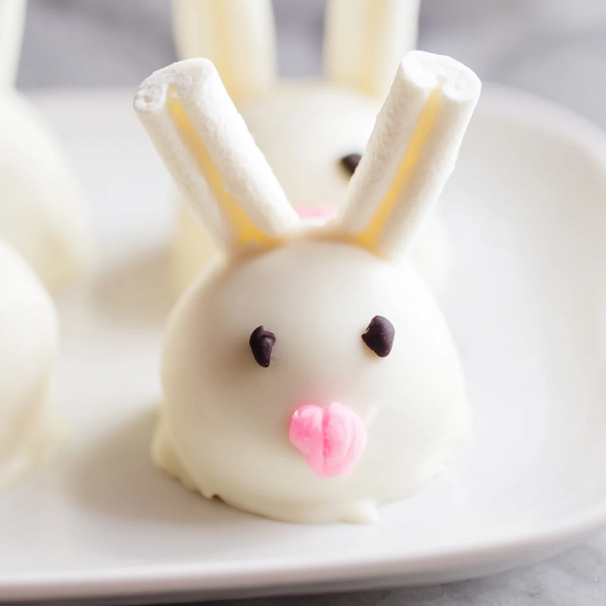Creamy Oreo truffles shaped into bunny heads and dipped in smooth white chocolate coating