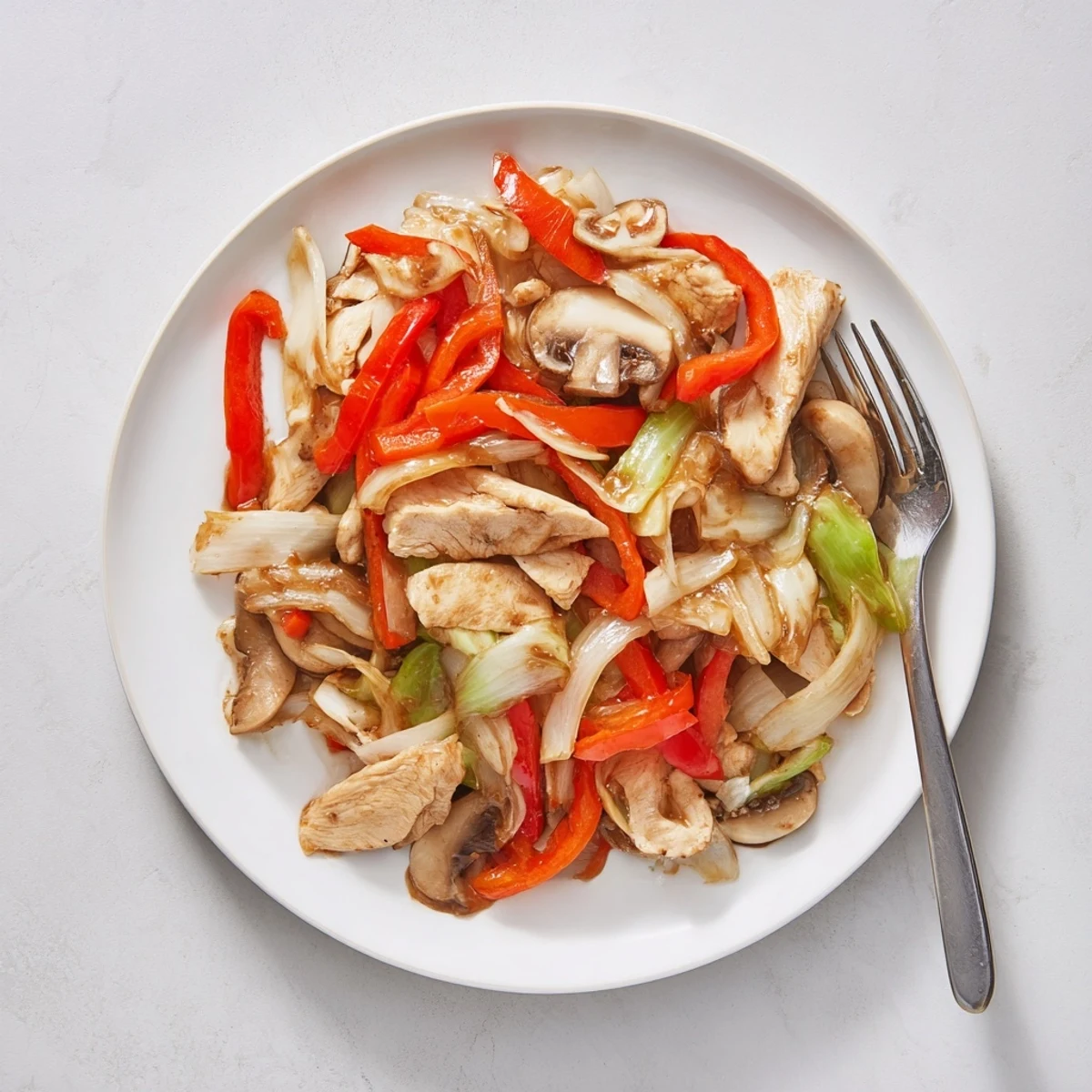 Hearty Chop Suey featuring juicy pork slices mixed with crunchy cabbage and aromatic ginger