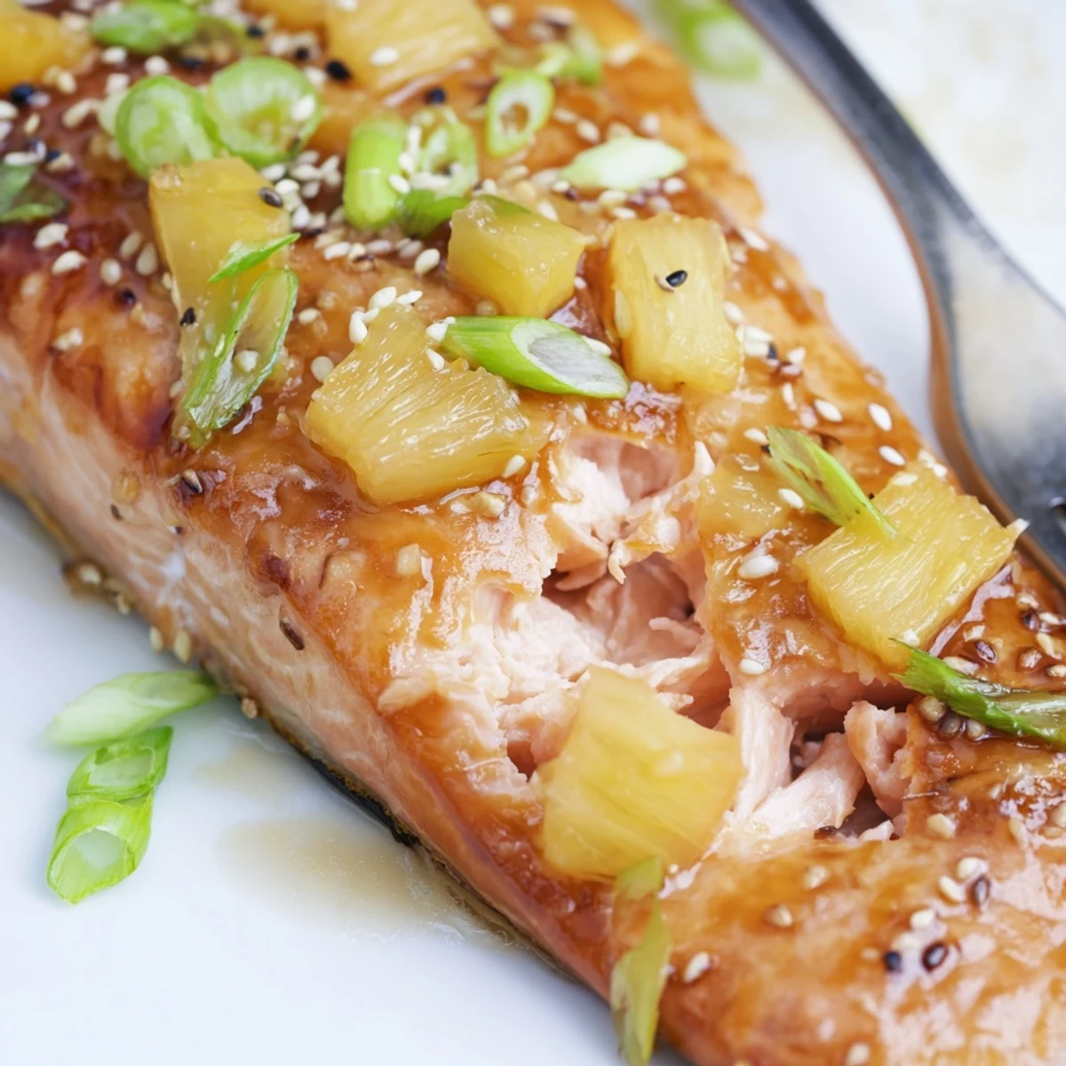 Golden brown pineapple glazed salmon fillets brushed with glossy sweet tangy sauce