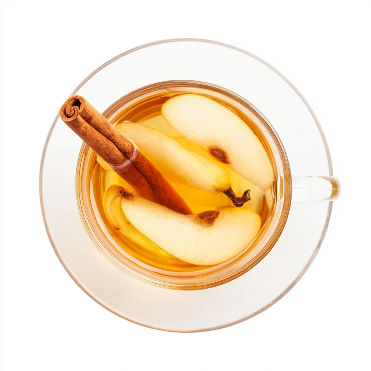 Warm cinnamon pear cider served in clear glass with floating pear wedges and aromatic whole spices