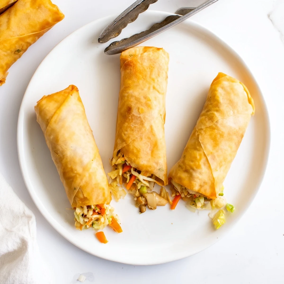 Close-up of crispy Vietnamese rice paper spring rolls golden brown after shallow frying