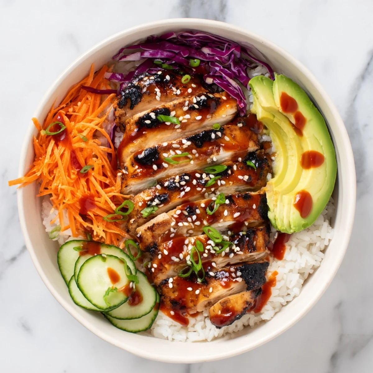 Golden grilled Korean BBQ chicken slices over fluffy white rice with colorful vegetables and spicy gochujang mayo drizzle