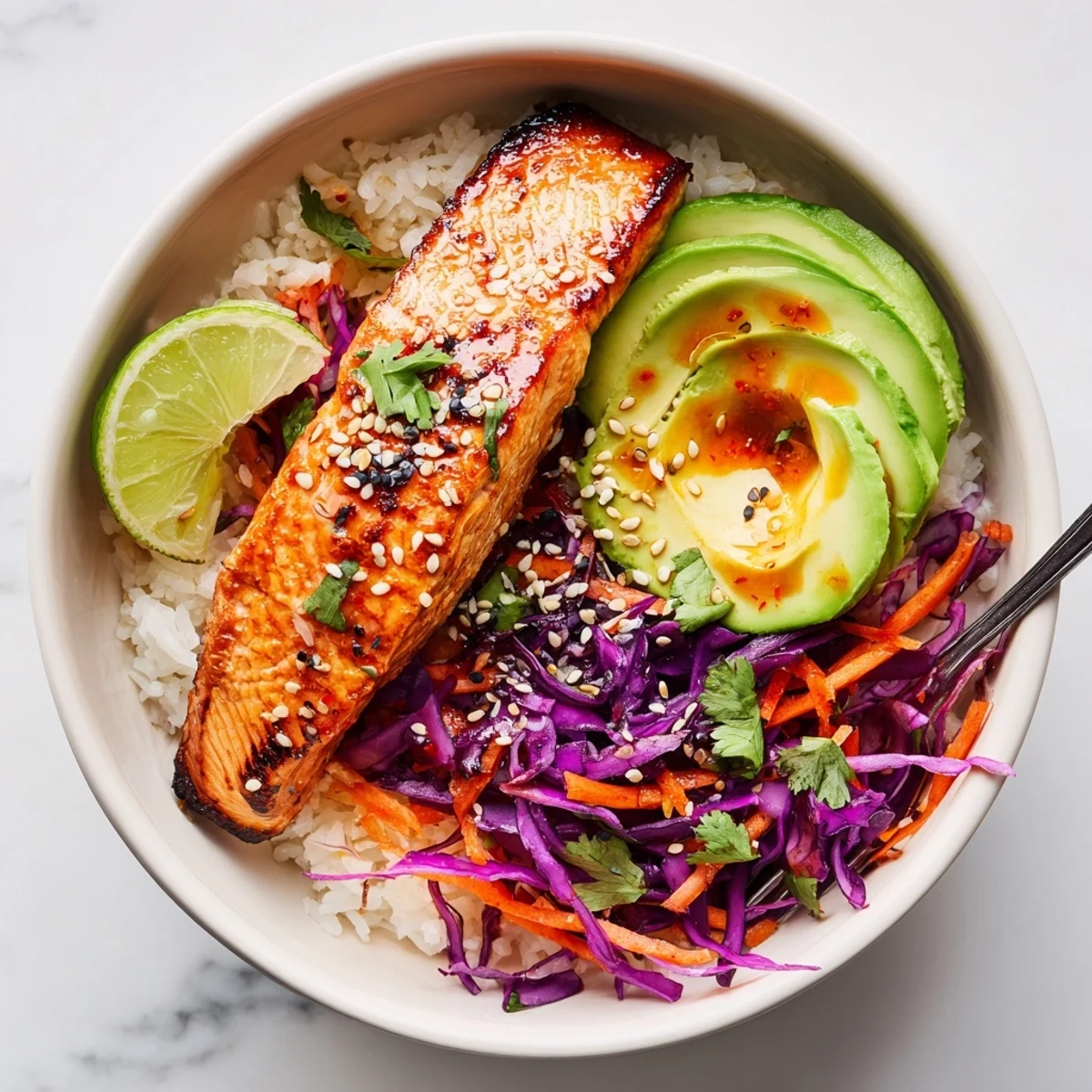 Bang Bang Salmon Bowls Recipe with flaky roasted salmon, creamy spicy sauce