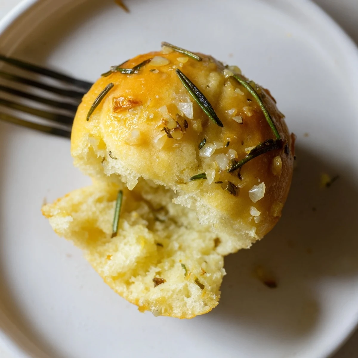 Golden Garlic Rosemary Focaccia Muffins smelling of roasted garlic and herbs