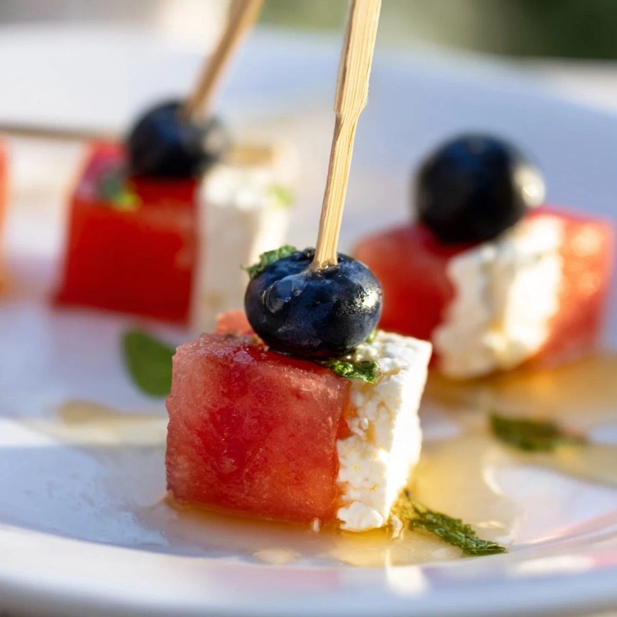 Patriotic Watermelon Feta Skewers arranged on platter, juicy watermelon and salty feta