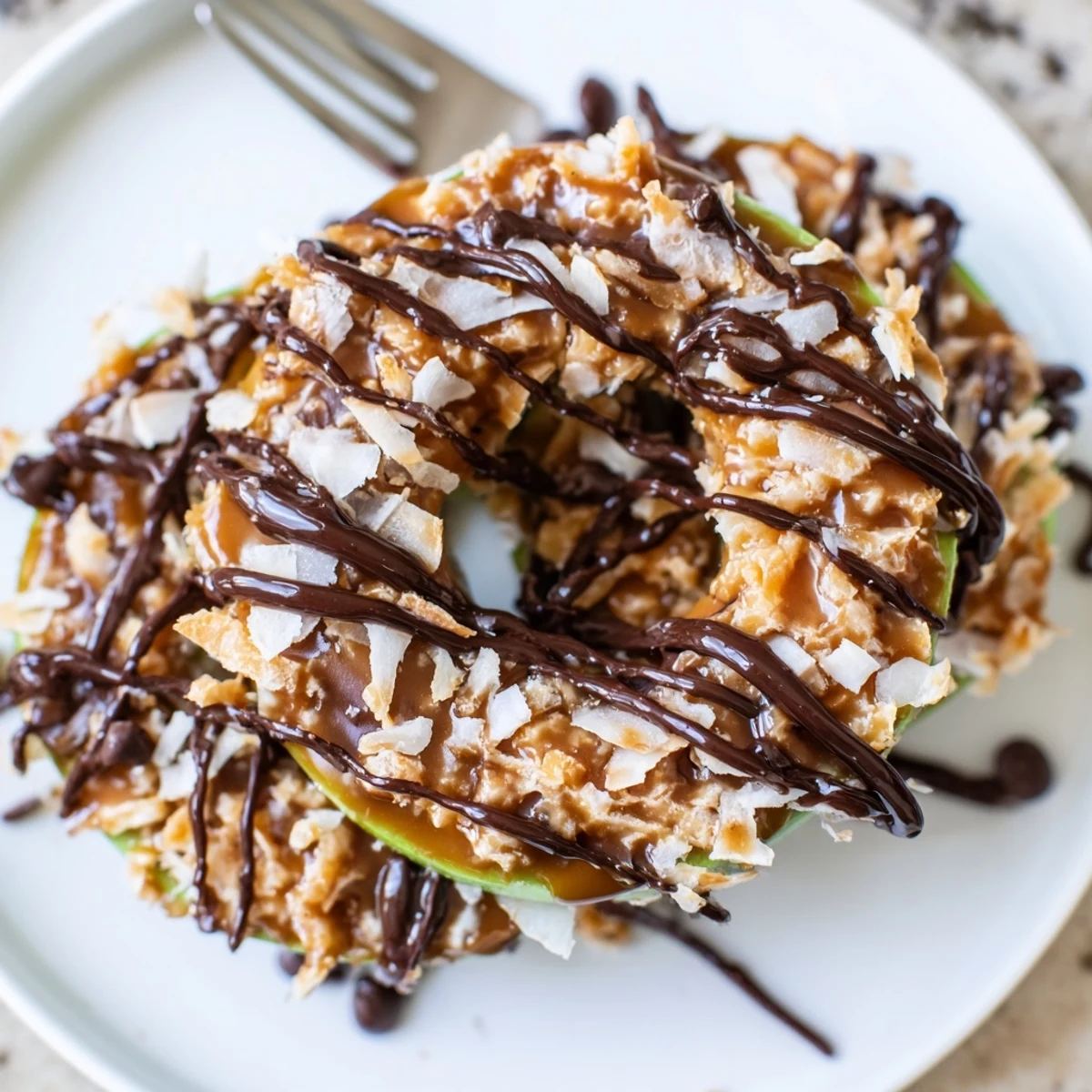 Samoa Apple Slices with gooey caramel, toasted coconut, and melty chocolate drizzle