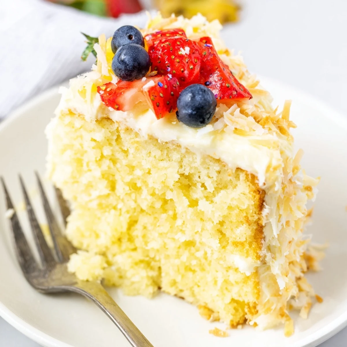 Moist Pineapple Coconut God Bless America Cake filled with tropical pineapple compote  