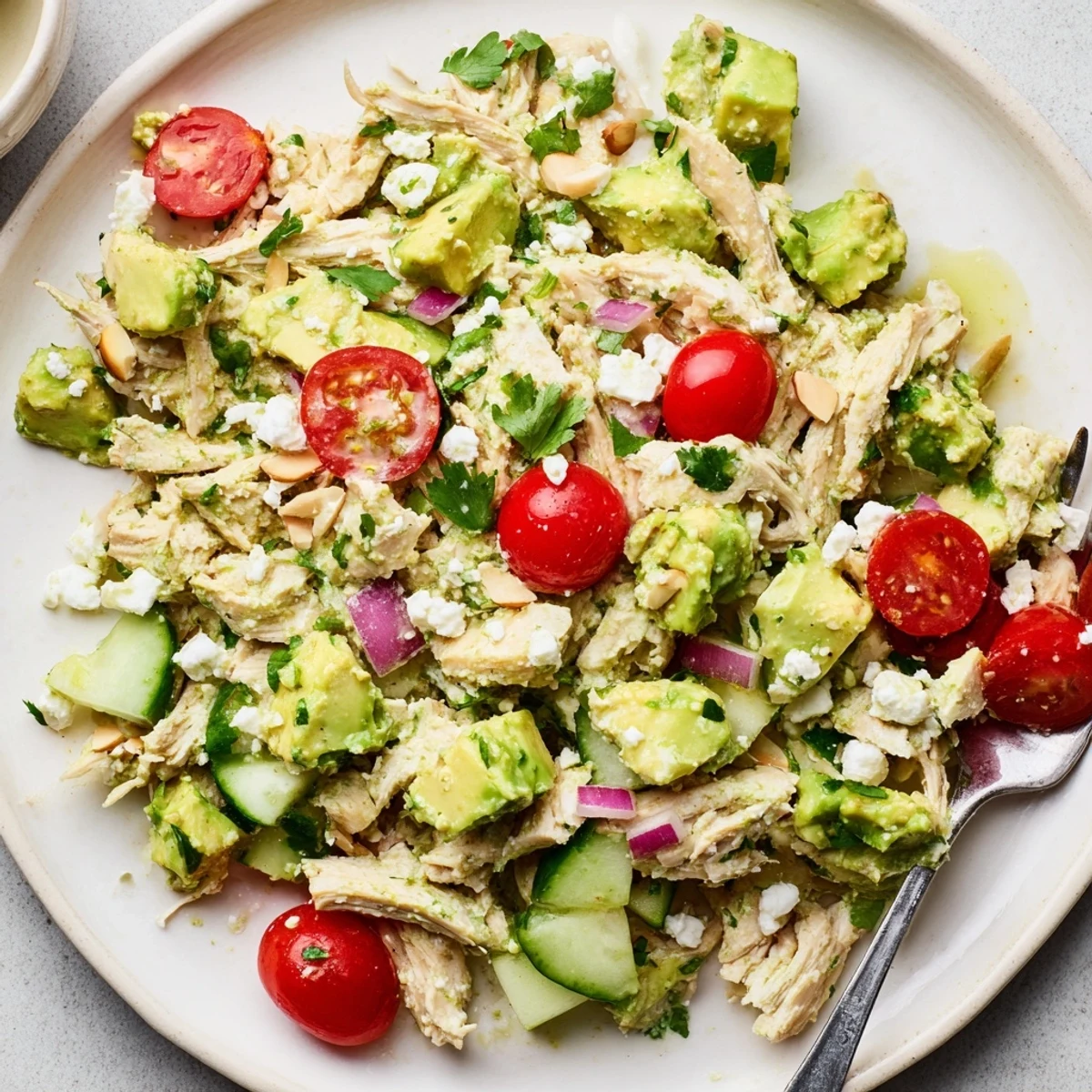 Creamy Avocado Chicken Salad with lime dressing, tender chicken, bright cherry tomatoes