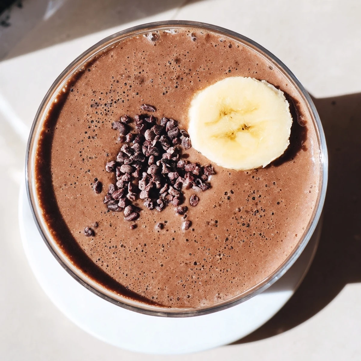 Thick raw chocolate banana shake blended with frozen bananas and raw cacao powder